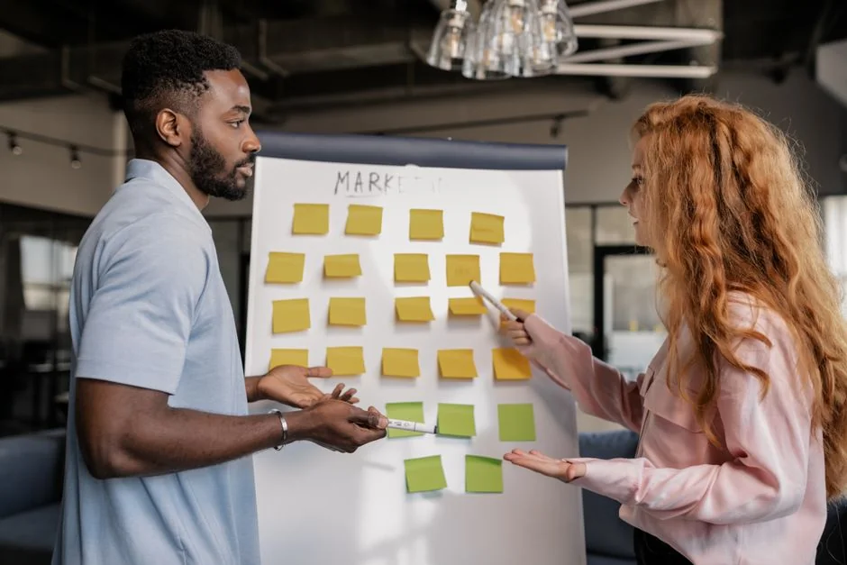 Sticky notes with holiday marketing ideas for Christmas social media and email campaigns.